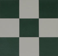 Zoomed in on green and white squares on roll up chess board.