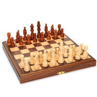 Magnetic folding walnut wood board with chess pieces on board.