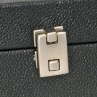 Zoomed in picture of lock on briefcase.