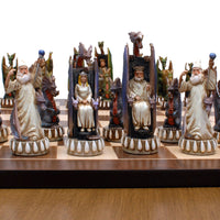 Dragon chessmen on chessboard. Image focuses on the king and queen.