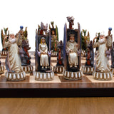 Dragon chessmen on chessboard. Image focuses on the king and queen.