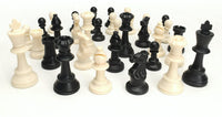 Black and white Staunton chess pieces scattered together.