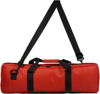 Red travel canvas bag with carrying handle and shoulder strap.