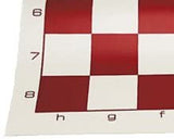 Zoomed in on the corner of red roll up chess board.