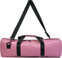 Pink travel canvas bag with carrying handle and shoulder strap.