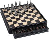 Silver chessmen on Black Stained wood board with brass chessmen inside the drawer.