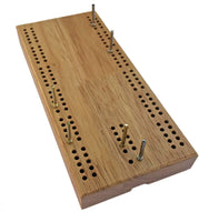 Cribbage board with metal pegs in the board.
