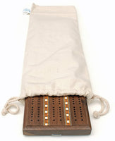 Dark brown cribbage board partially sitting out of cloth canvas storage bag with drawstring.