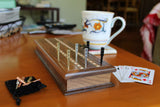 Ultimate cribbage pegs being used on cribbage bard on table.