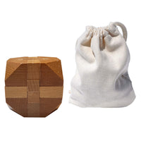 Solid wood 3d cube puzzle with slanted corners and drawstring cloth bag.