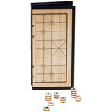 Chinese chess game folded with pieces sitting in front.