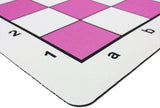 Rounded corner of pink mousepad chess mat.
