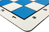 Rounded corner of blue mousepad chess mat.