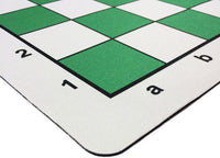 Rounded corner of green mousepad chess mat.