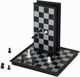 2 magnetic chess boards. one folded standing on top of the other board.