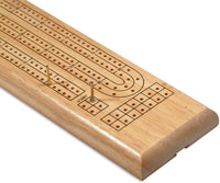 Cribbage board with a peg in start position and a peg moved up.