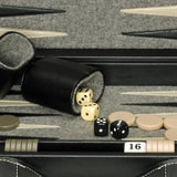 Zoomed in of center of briefcase with dice and dice cup.