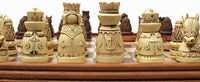 Zoomed in on ivory chessmen on wood board.
